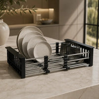 Dish rack with plates and cups on a kitchen counter