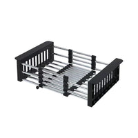 Black dish rack with metal shelves on a white background
